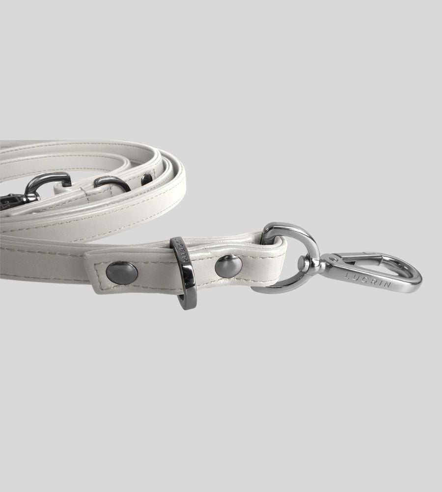 Close-up clasp detail on premium white leather dog leash