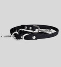 Coiled black leather dog leash with silver snap hook and O-rings