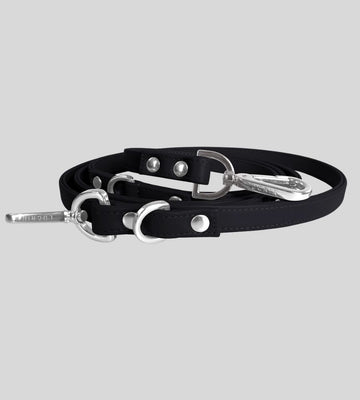 Coiled black leather dog leash with silver snap hook and O-rings