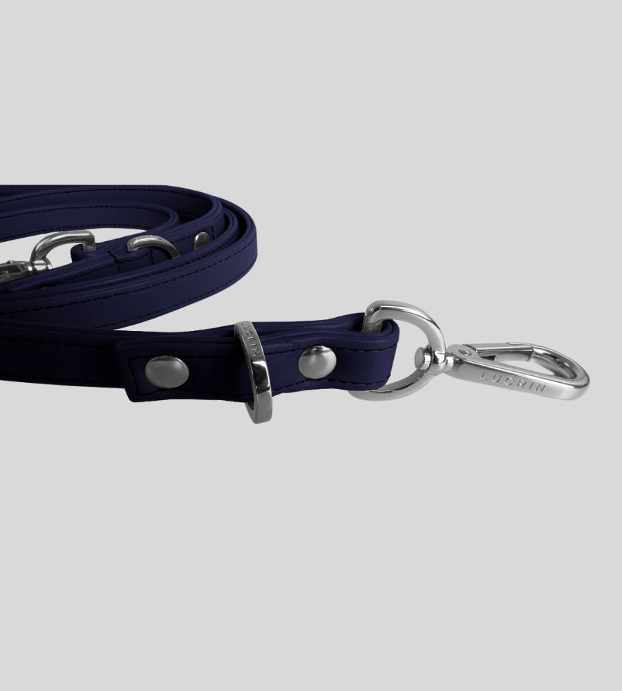 Close-up clasp detail on premium navy leather dog leash