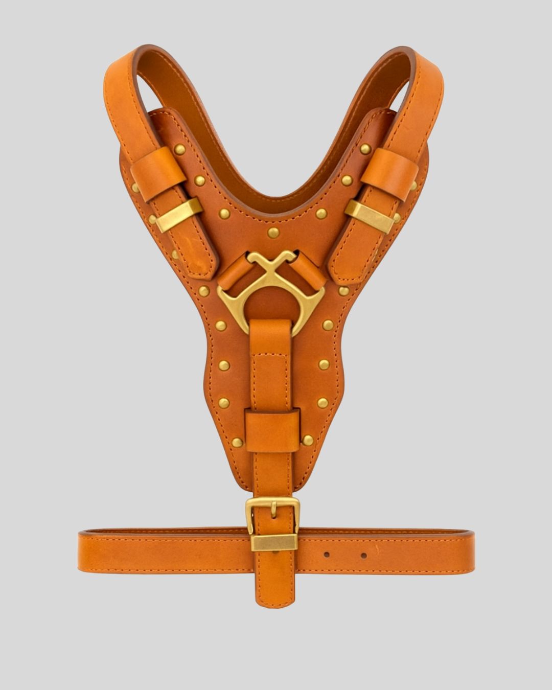 Full-body tan leather tactical dog harness with brass hardware