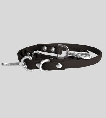 Coiled dark brown leather leash with silver hardware
