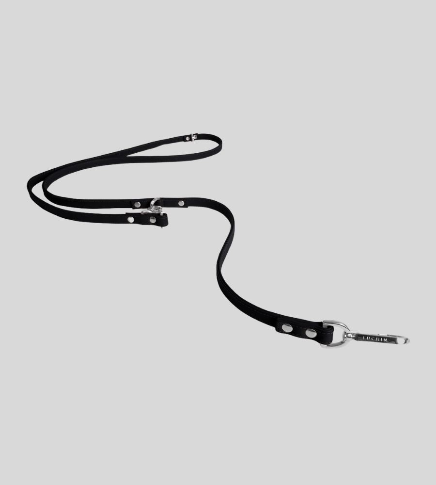Extended black leather leash showing adjustable training rings