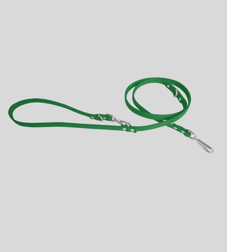Coiled light green leather dog leash with rivets