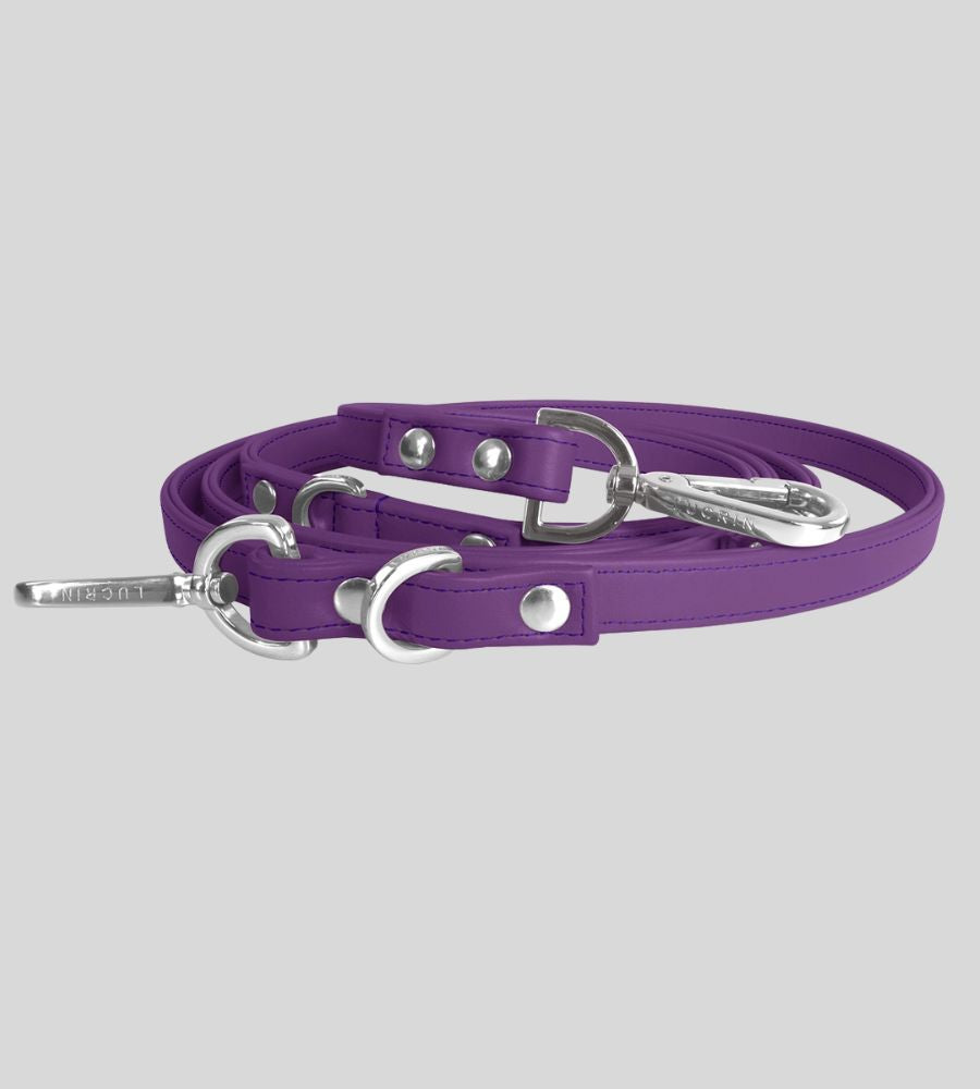 Coiled white leather dog leash with silver hardware